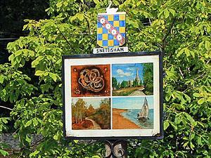 The colourful Snettisham village sign in west Norfolk.