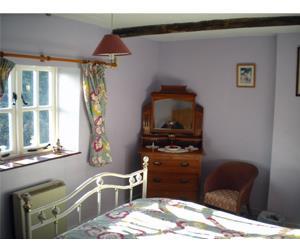 The main bedroom of Primrose Cottage in Great Massingham, west Norfolk.