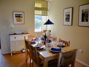 The dining room with a table dressed for six guests in this self-catering property in Brancaster Staithe.