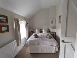 The master bedroom in Bluebell Cottage in Bluebell Cottage in Docking, West Norfolk.