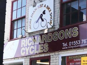 The outdoor sign of Richardsons Cycles in King's Lynn, west Norfolk.