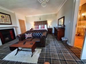 The bedroom with fireplace at Belle Vue Guest House in Denver near Downham Market.