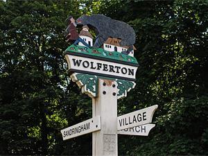 The village sign at Wolferton in west Norfolk.