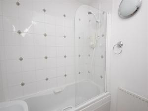 Bath with shower in bedroom 1 ensuite.