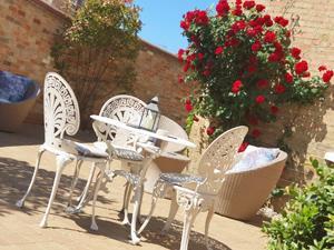 The outdoor seating area at Belle Vue Guest House in Denver near Downham Market.