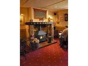 Cosy fireplace inside The King William IV in west Norfolk.