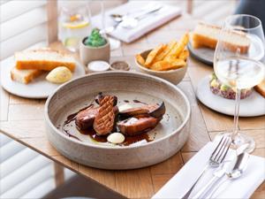 Delicious locally sourced dishes of food served on a table at Socius in Burnham Market, west Norfolk.