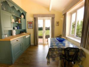 Hand crafted kitchen, utility room off with butlers sink.