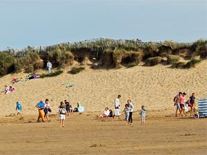 Holiday makers on Brancaster beach.