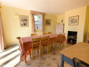 Kitchen dining area with feature fireplace.