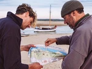 Two men looking at a map.