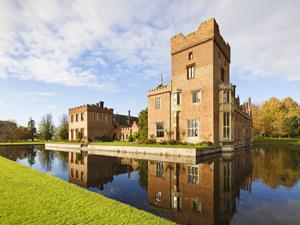 Exterior shot of Oxburgh Hall and the surrounding moat in west Norfolk.