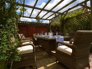 Outdoor seating areas at Holiday Cottages.