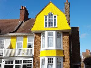 The yellow exterior of Miramar Guesthouse in Hunstanton, west Norfolk.