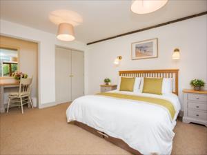 The master bedroom in the Crew Yard at Church Farm Barns in Bircham Newton.