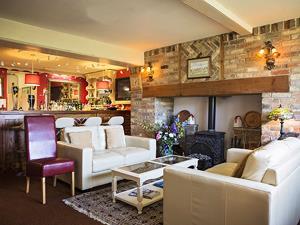 Enjoy drinks beside an inglenook fireplace at Great Danes Country Inn.