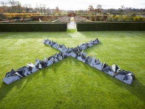 Houghton Cross, - new sculpture part of Richard Long Exhibition EARTH SKY in the  Walled Garden croquet lawn