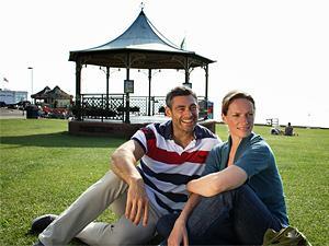 A couple sitting in front of the Hunstanton Bandstand in west Norfolk.