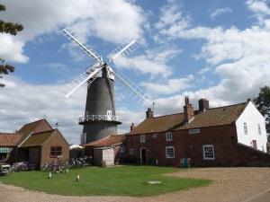 Outdoor shot of Bircham Windmill in the Great Bircham countryside.