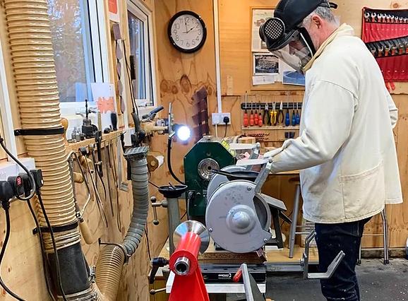 Showing woodwork at a lathe.