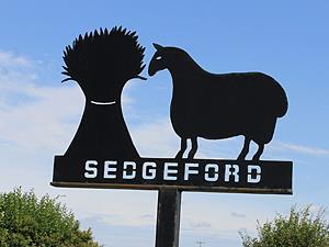 The village sign in Sedgeford in west Norfolk.