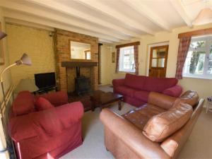 Cosy, comfortable sitting room with log burning stove.