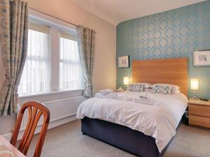 A warm welcome guaranteed at Ellinbrook Guesthouse. Shot of a bedroom.