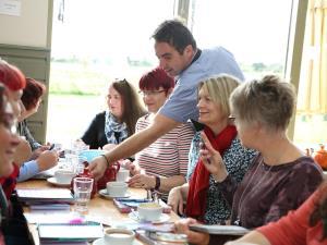 A group of people enjoying dishes served at Creake Abbey in west Norfolk.