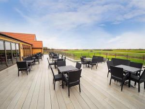 1st Floor balcony with sweeping views across the golf course.