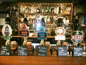 Well-stocked bar full of delicious beverages in The Rose & Crown in Harpley, west Norfolk.