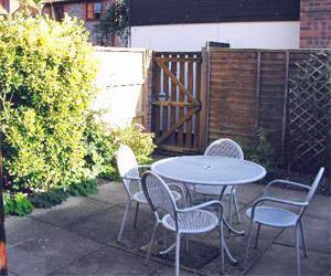 Pretty courtyard garden perfect for eating outside and secure for your children and for your pets.