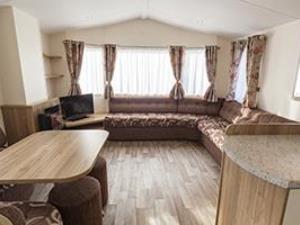 The living and dining space inside a caravan at Searles Leisure Resort in Hunstanton, west Norfolk.