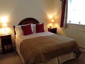 A comfortable bedroom at Foxgloves Cottage in Hunstanton, West Norfolk.