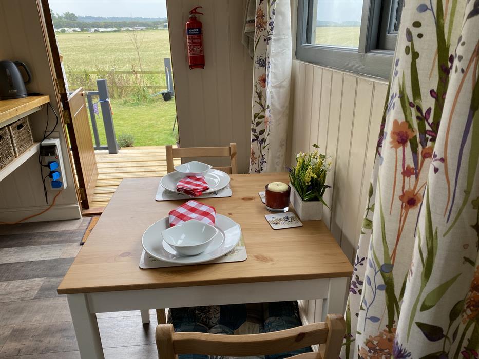 bistro seating for 2 to enjoy meals with a view of the norfolk countryside, just a 2 minute walk from the beach