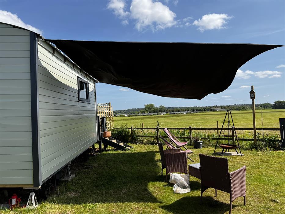 blue skies, sunshine and stunning views at our glamping shepherds huts