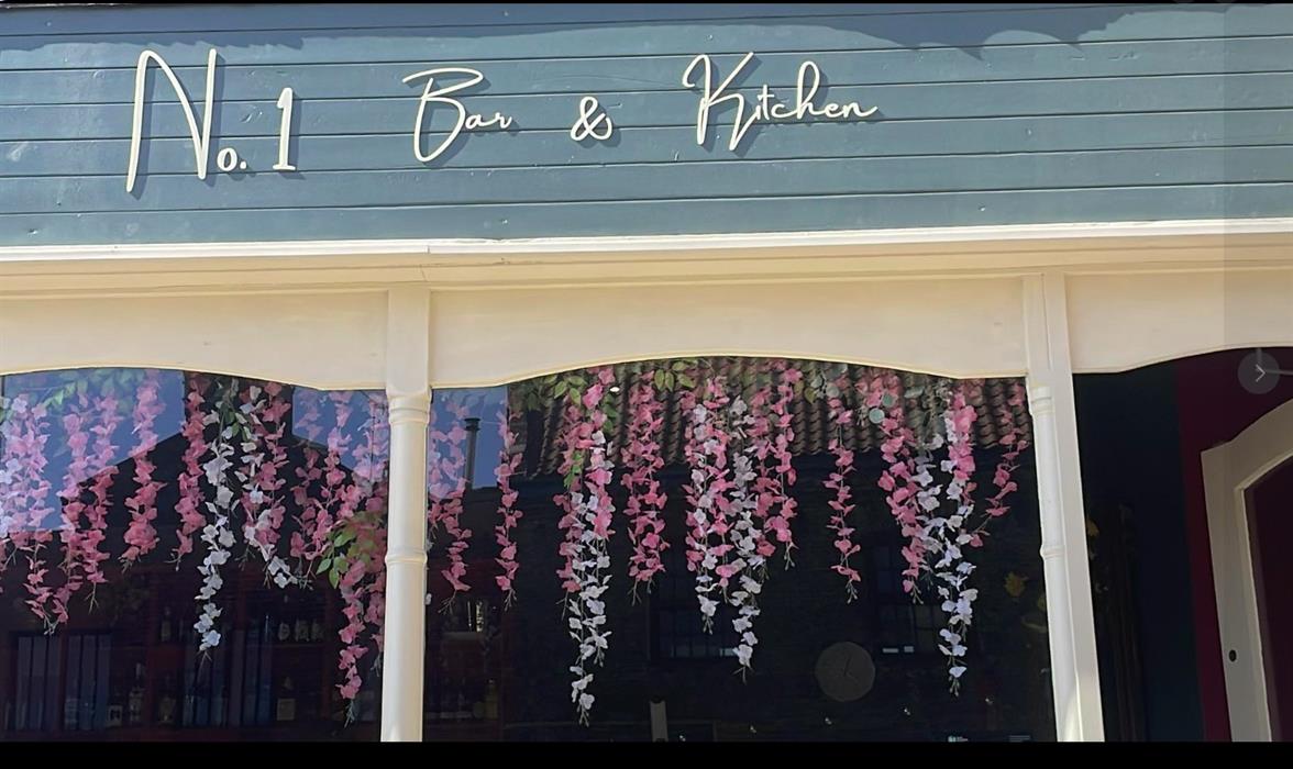 No 1 Bar and Kitchen  signage above the door of restaurant