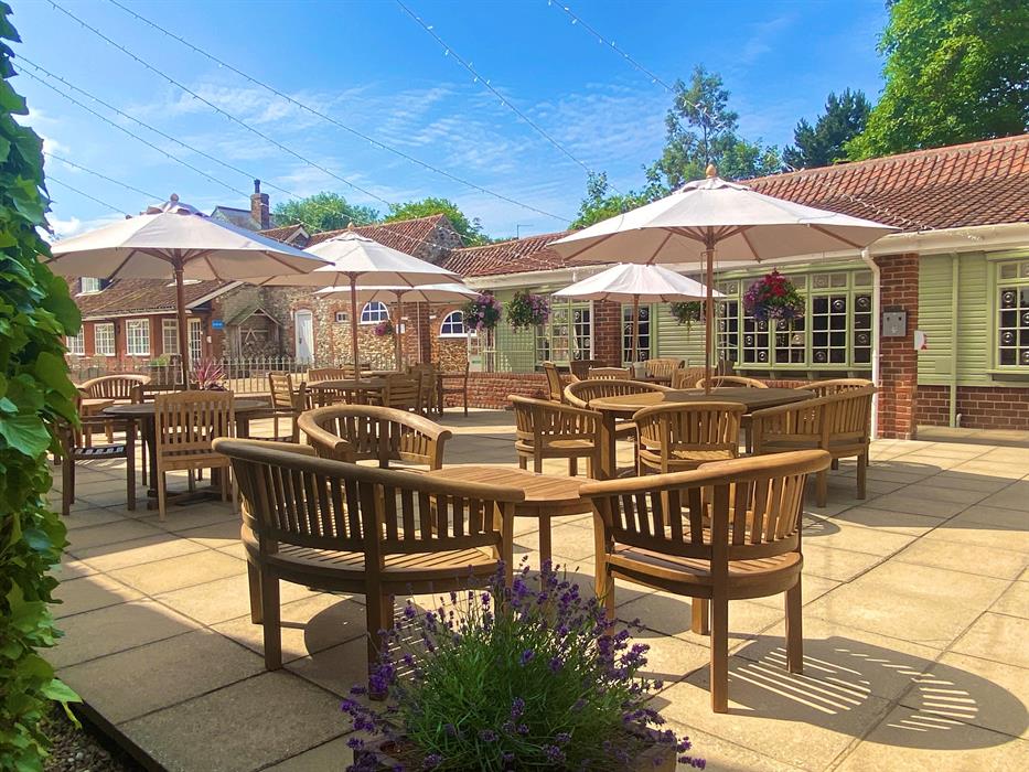 The outdoor hotel seating area at Caley Hall Hotel in Old Hunstanton.