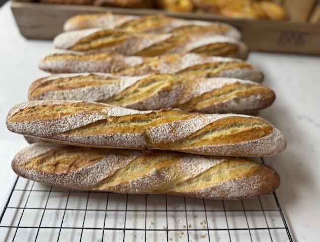 One image of person making bread rolls, two images of breads.