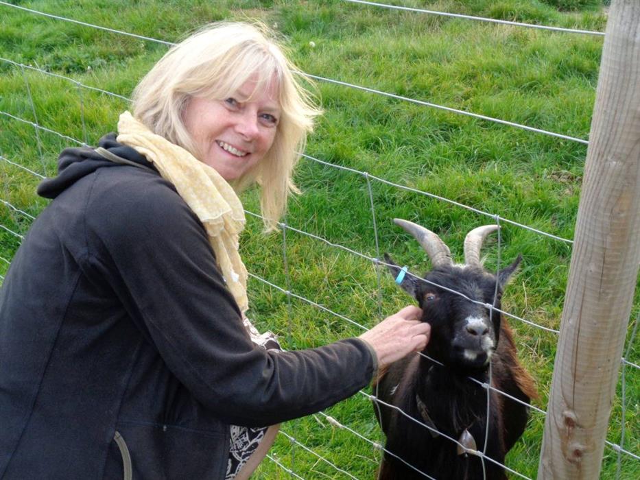 Picture of writer and teacher Sue Berge with a goat!