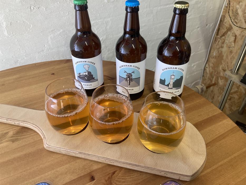 Image 1: Bottles of cider and glasses