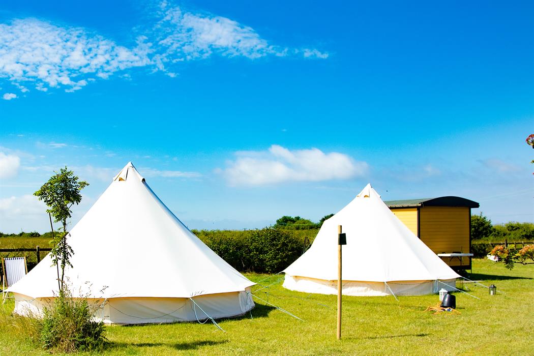 Hunstanton Glamping Bell Tens and Shepherds huts with stunning views out over the Norfolk countryside just a 2 minute walk from the beach