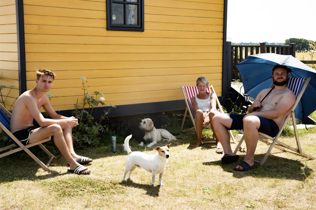 Family enjoying our glamping shepherds huts with their dog