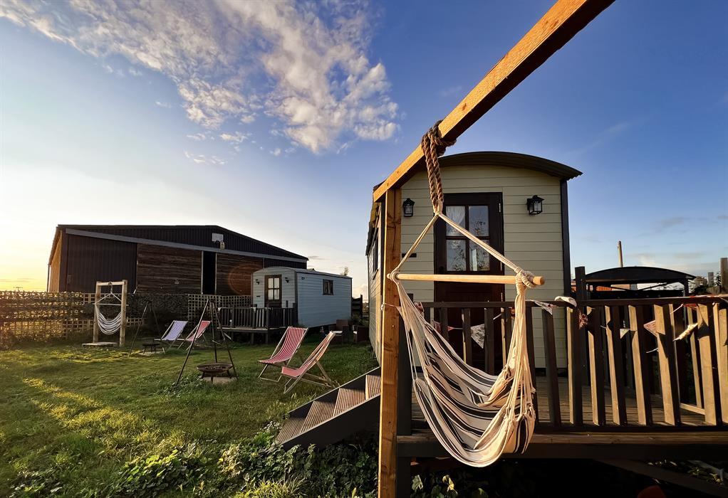 relaxing hammocks in our glamping shepherds huts