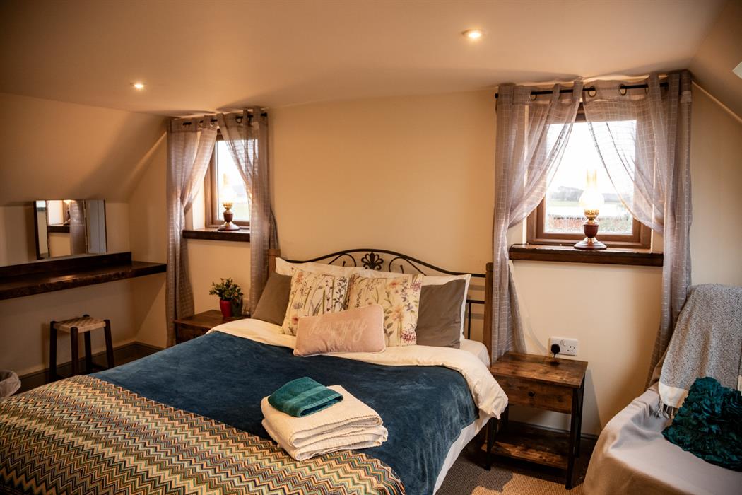 quirky master bedroom in the dairy